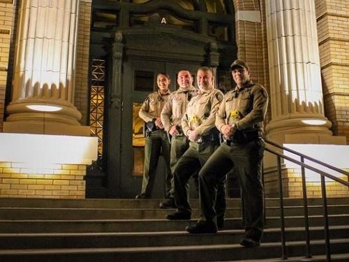 Patrol Officers Posed on Stairs at Night