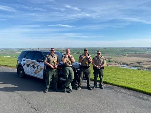 Squad Posed in Front of Patrol Vehicle